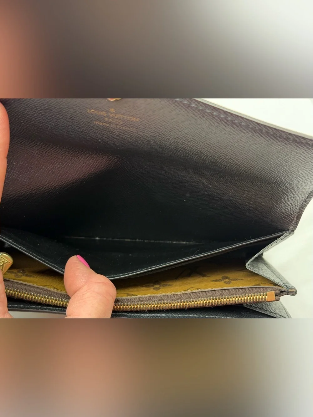 Louis Vuitton Sarah wallet in reverse monogram